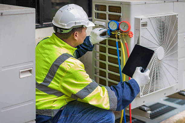 Professional Heat Pump Repair technician working in Glen Head, NY
